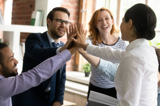 istock Happy successful multiracial colleagues giving high five, celebrating success. 1324268076