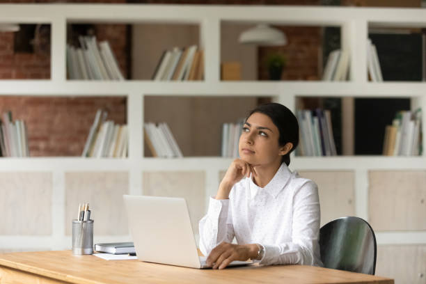 istock Motivated young indian business lady considering project risks. 1324268372