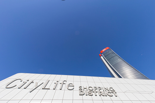 Shanghai, China - September 19, 2019: Tomorrow Square in Huangpu District, designed by John Portman and Associates, with flags of the JW Marriott Hotel Shanghai at Tomorrow Square, which it houses.