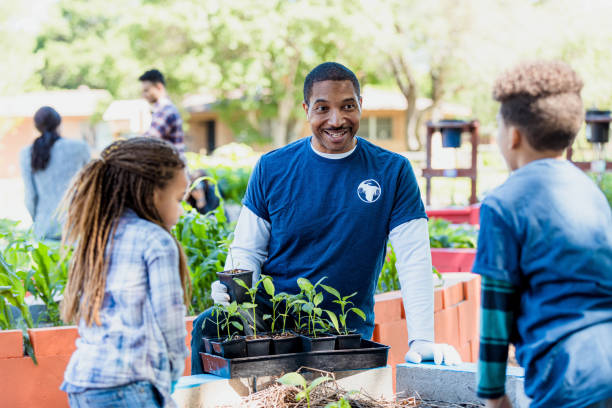 istock Children chat with community garden volunteer 1324276109