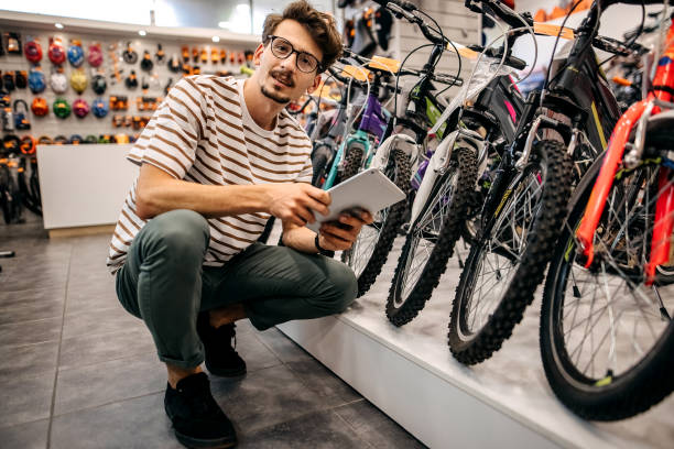 istock Man who works in a bicycle shop 1324280429