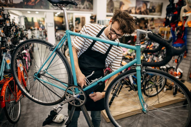 istock Smiling bike mechanic 1324280584