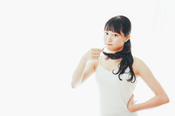 istock Young woman worrying about hair damage 1324282550