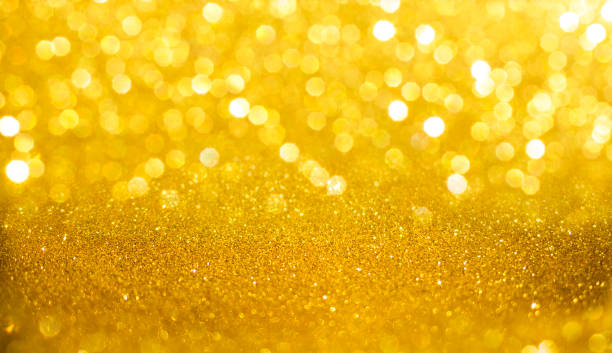 istock Yellow, shiny background with focus and bokeh 1324285390