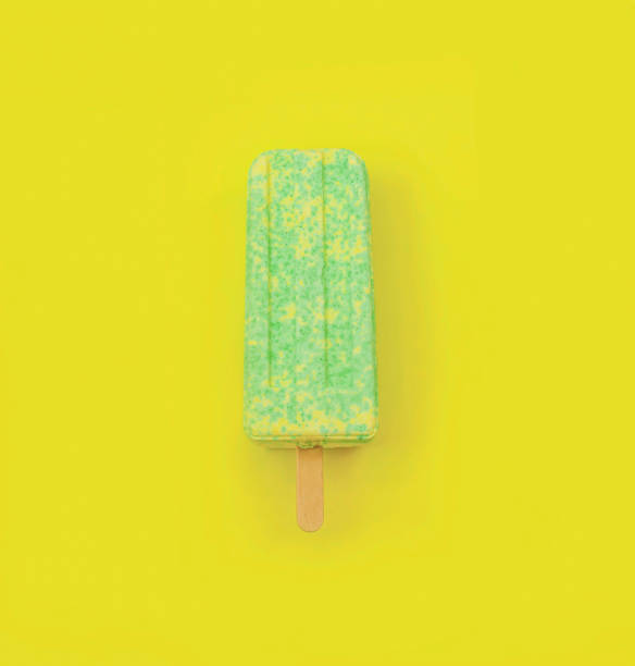 istock ice cream on a stick on a yellow background 1324288317