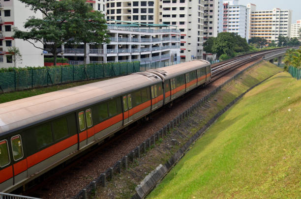 Singapore- Feb 4, 2014: Singapore mass rapid train (MRT) travels on the track. The MRT has 106 stations and is the second-oldest metro system in Southeast Asia.