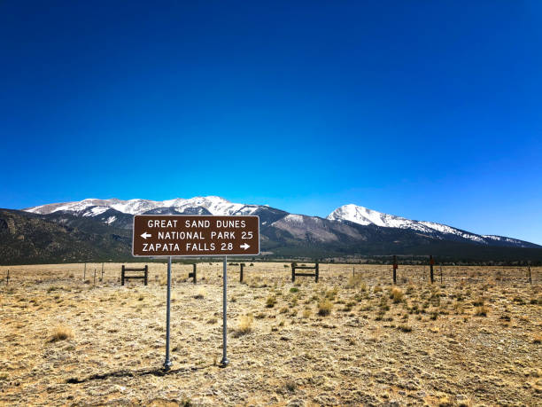 Directional Sign to Great Sand Dunes, Colorado Directional Sign to Great Sand Dunes, Colorado great sand dunes national park stock pictures, royalty-free photos & images
