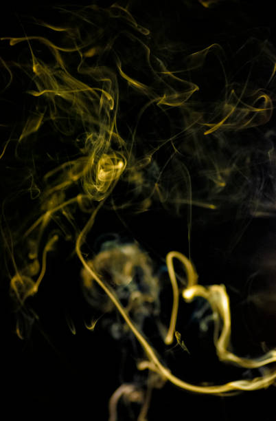 istock Yellow golden smoke in swirling pattern 1324294168