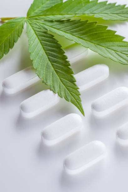 istock Cannabis leaf and medical manufacturing 1324294179