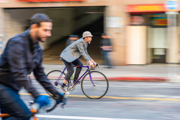 istock Male Bikers in 30s and 40s Riding Through Downtown District 1324296167