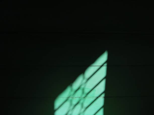 istock Morning sun shadow on the wall of the board 1324304083