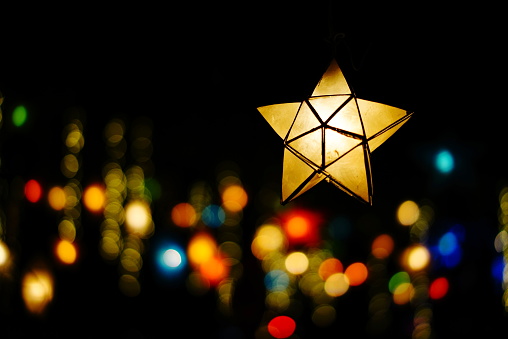 Colourful illuminated Christmas star decorations at Bath Christmas Market.