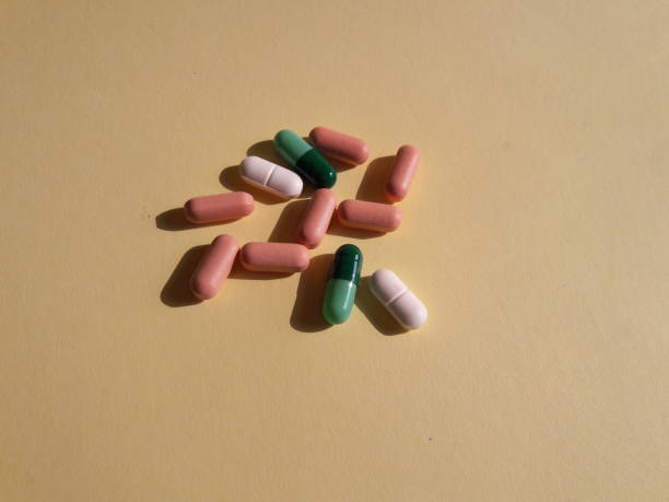 istock photo of capsules, tablets and bottles lying on the table 1324313472