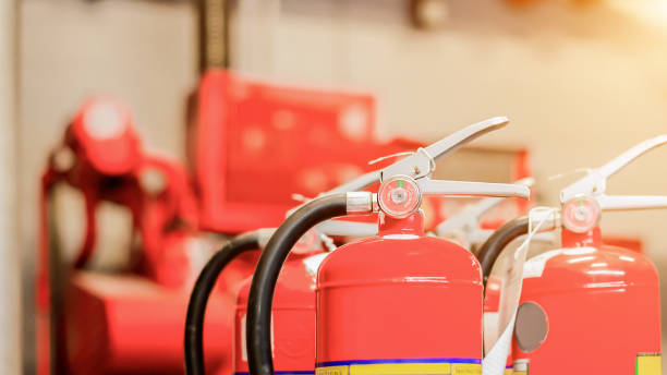 istock The red fire extinguisher is ready for use in case of an indoor fire emergency. 1324316673