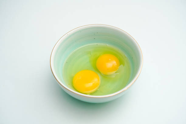 istock Fresh eggs in a blue porcelain bowl. Healthy breakfast 1324321872