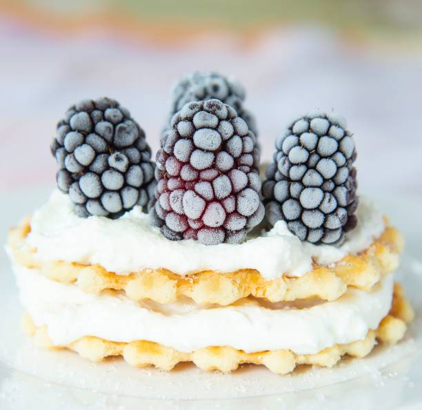 Golden waffles with blackberries and cream cheese