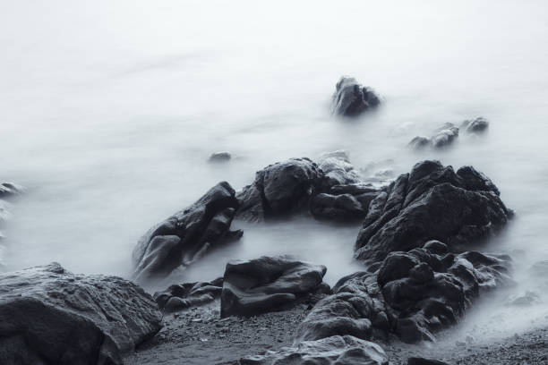 istock Black and white seascape long exploser for soft motion water and stone 1324323499