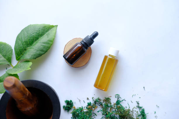 istock eucalyptus essential oils in a glass bottle with green leaf on white background 1324326914