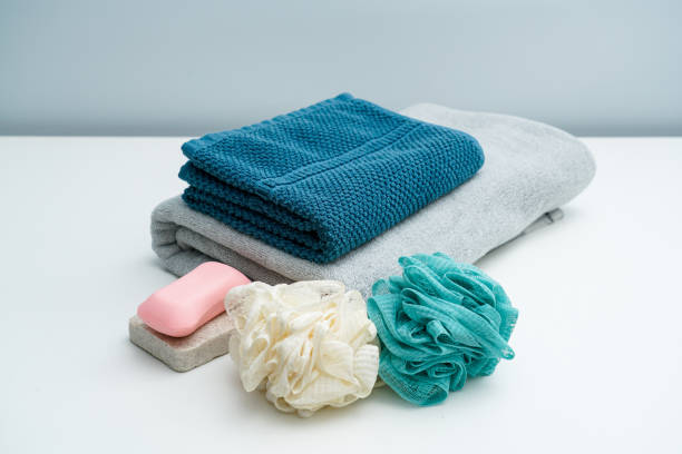istock Couple towel and bath ball soap on white table 1324327767