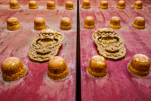 Close up of the red lacquer gate of the temple of heaven in Beijing, China.
