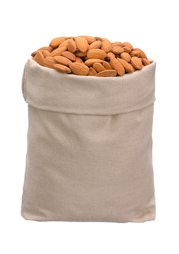 healthy delicious almonds in a full bag on a white isolated background