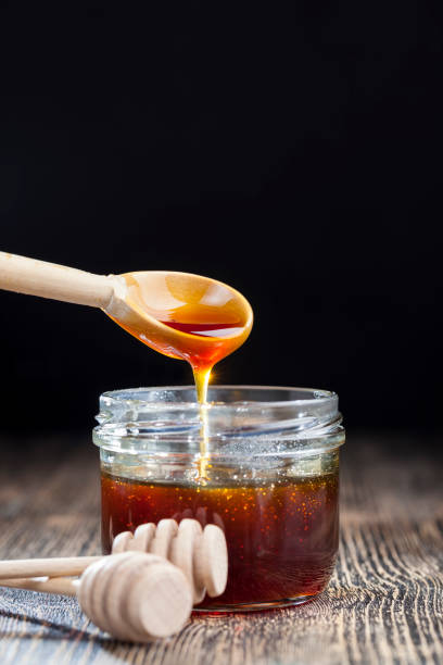 istock current thick and delicious sweet honey, close up 1324331158