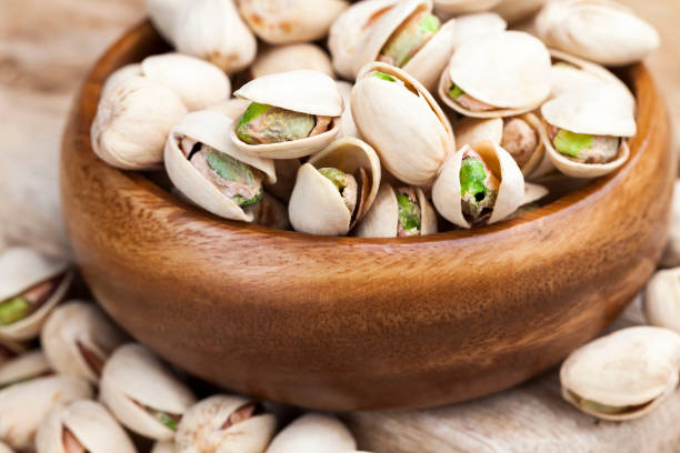 istock delicious and salty pistachio nuts 1324332193