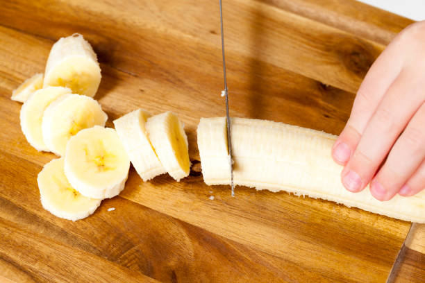 istock making smoothies with yellow banana 1324332296