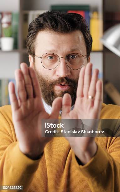 Disagreement Stop No Says Frightened Worried Handsome Bearded Man In Glasses Looks At Camera And Starts Waving His Arms Nervously Shouting Nonono Closeup Stock Photo - Download Image Now
