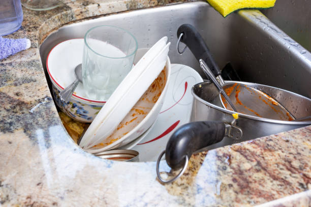 istock dirty dishes in sink 1324333997