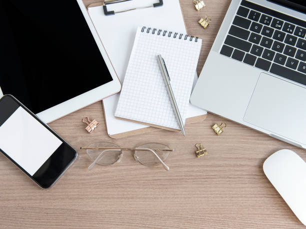 istock Laptop with office supplies on the table. 1324336230