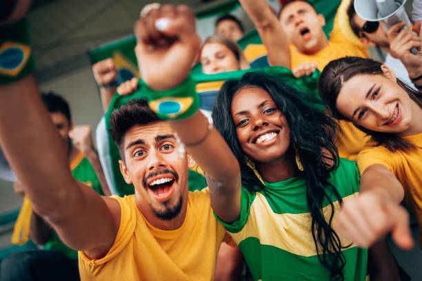 istock brazilian supporters have fun at the stadium 1324339101