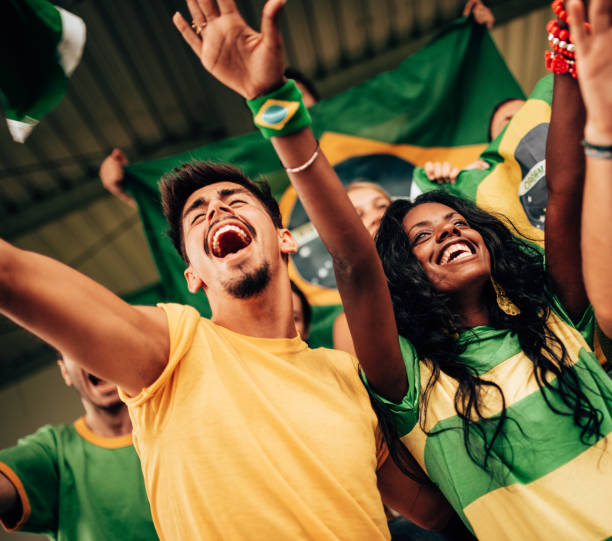 istock brazilian supporters have fun at the stadium 1324339133