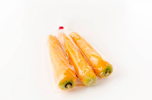 istock Kinbininjin, yellow carrot in plastic bag on white background 1324340481