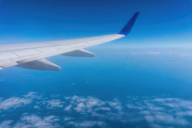 istock Wing of a passenger plane and the sky overboard 1324342574