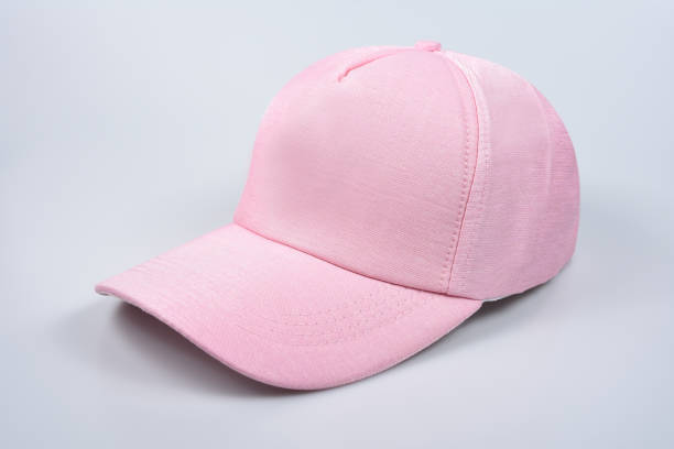 istock Baseball pink cap isolated on white background. Front and side view. 1324345740