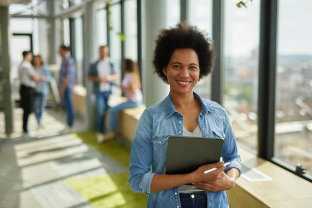 istock A successful female web designer holding digital tablet in the office hallway 1324346657