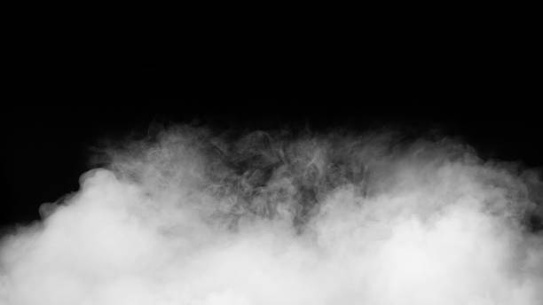 istock White smoke or fog isolated on black background. 1324347908