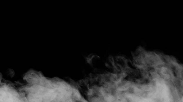istock White smoke or fog isolated on black background. 1324347931