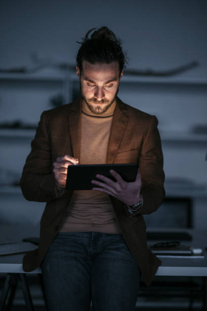 istock Late Night Work At Home: Handsome Businessman With Beard Using Tablet 1324348226
