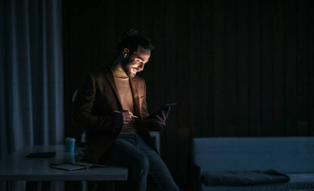 istock Late Night Work At Home: Businessman With Beard Using Digital Tablet 1324348231