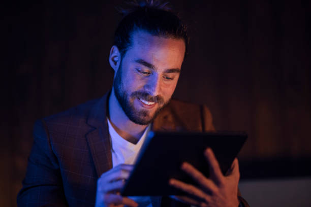 istock Late Night Work At Home:Handsome Businessman With Beard Holding Tablet 1324348240