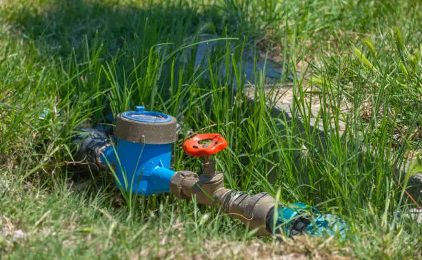Photo of water valve in the garden, irrigation equipment