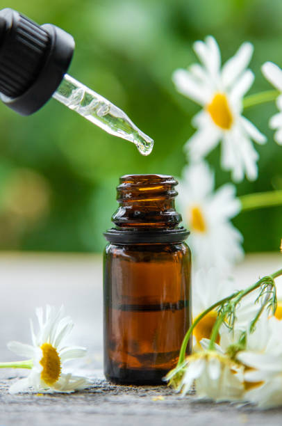 istock Essential oil extract of medicinal chamomile. Selective focus. 1324352943