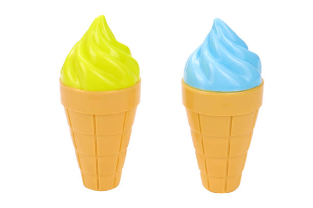 istock Green and blue ice cream in a waffle cup on a white background, isolated image. Colored ice cream 1324360170