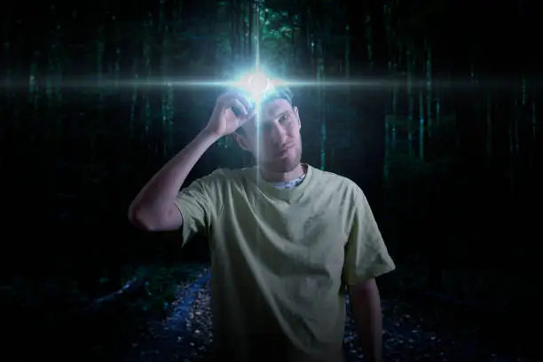 head torch light lamp on the person, exploration and adventure activity outdoor