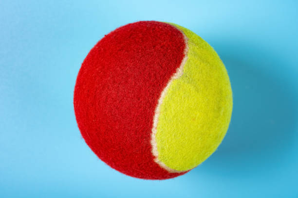 istock tennis ball on a blue background close up 1324361185