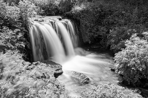 Long exposure of a waterfall flowing onto Lee Abbey Beach in Devon