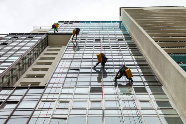 istock Industrial mountaineering workers hangs over residential facade building 1324363961