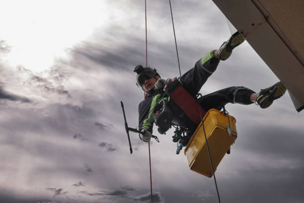 istock Industrial mountaineering worker hangs over residential facade 1324363966